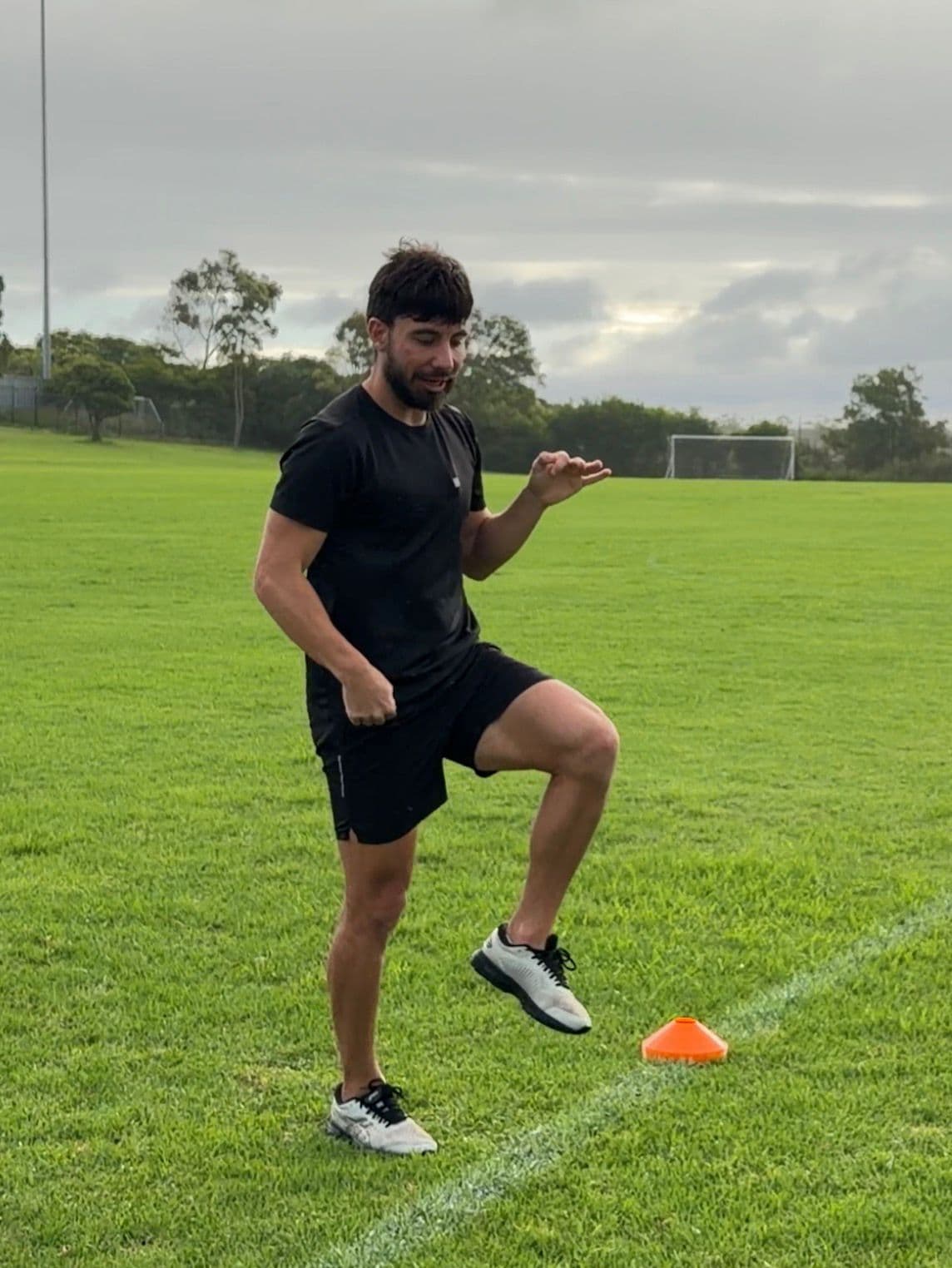 Anthony Atanasov coaching on field